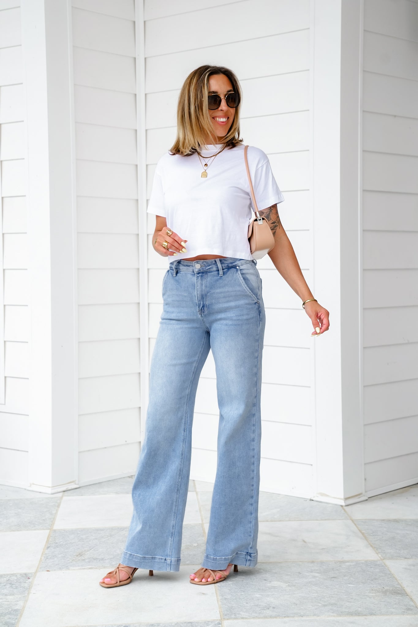 Risen High Rise Light Wash Wide Leg Jeans with Slanted Pockets