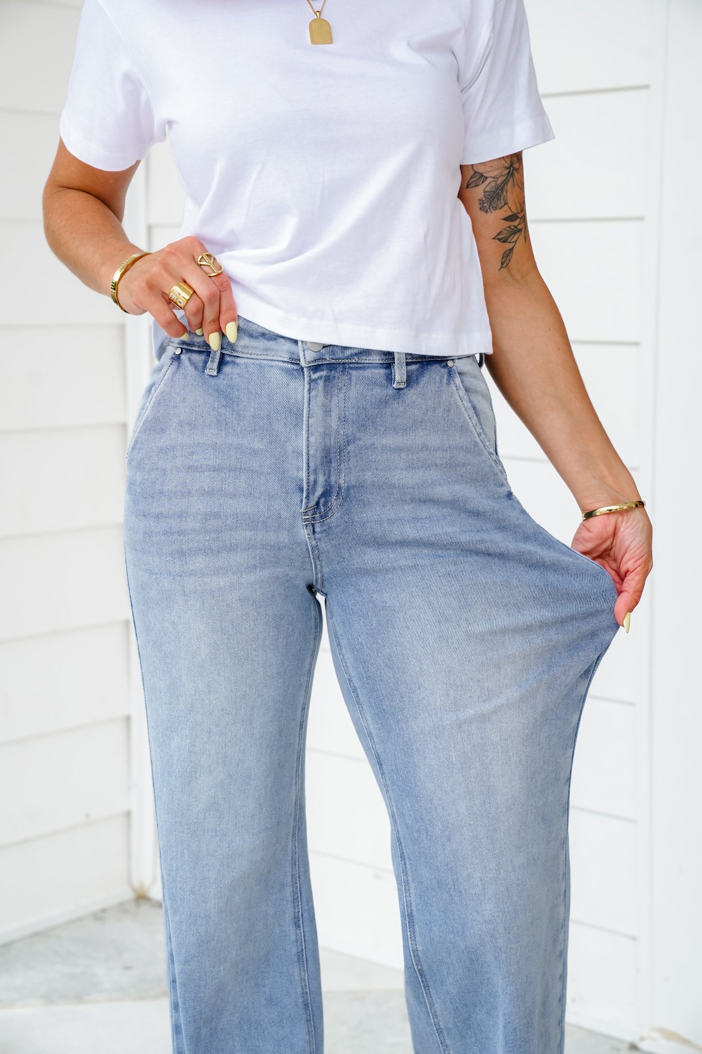 Risen High Rise Light Wash Wide Leg Jeans with Slanted Pockets