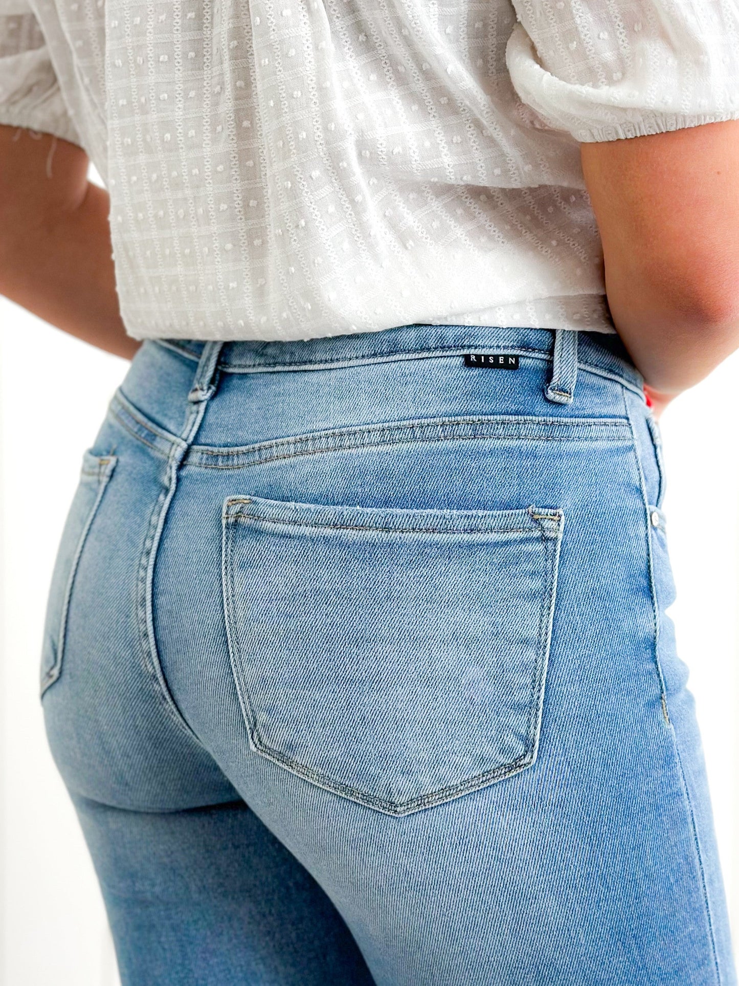 Risen Mid Rise Medium Wash Relaxed Skinny Jeans
