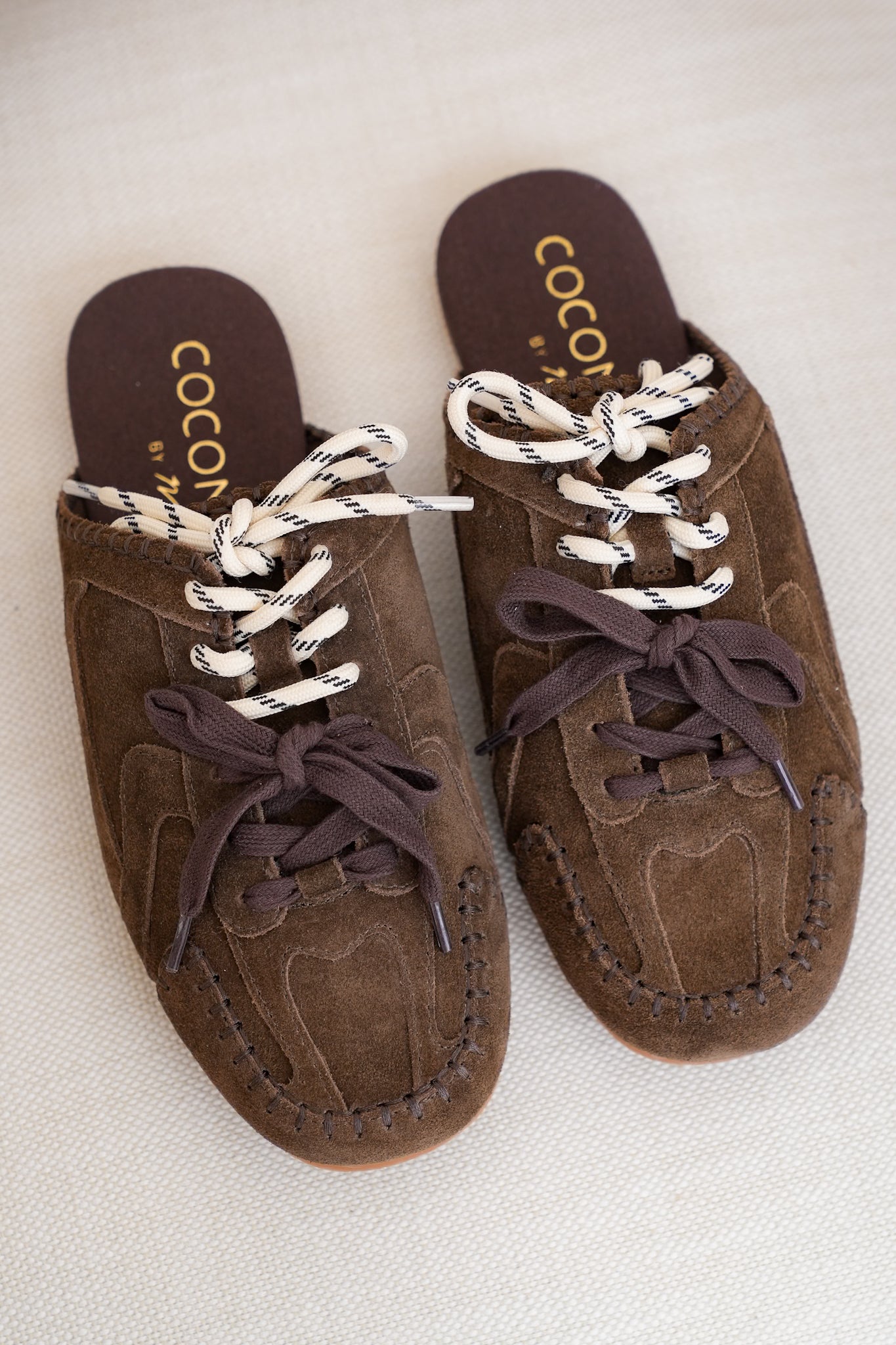 Slip On Mule with Moccasin Toe Stitching and Lace Up Detail