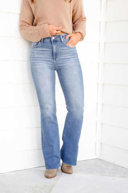 High Rise Medium Wash Flare Jeans with Raw Hem