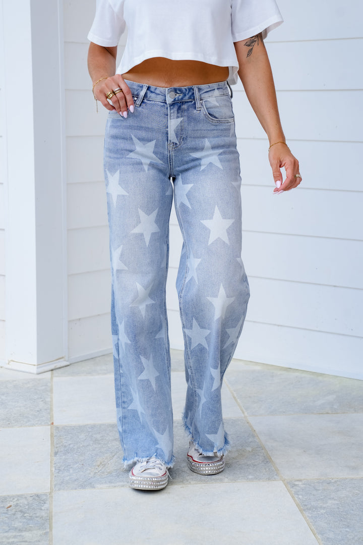 Risen High Rise Light Wash Wide Leg Star Print Jeans