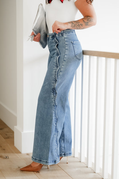 Risen High Rise Medium Wash Wide Leg Jeans with Scalloped Edge