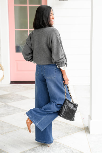 Risen Mid Rise Medium Wash Wide Leg Knit Jeans