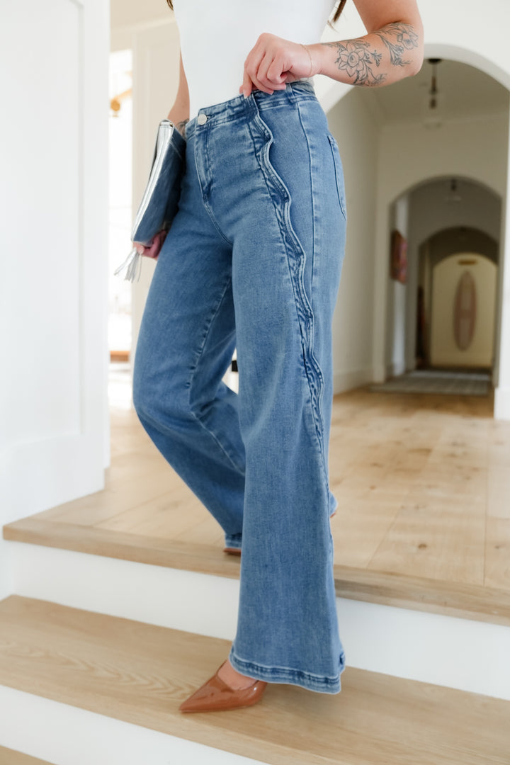 Risen High Rise Medium Wash Wide Leg Jeans with Scalloped Edge
