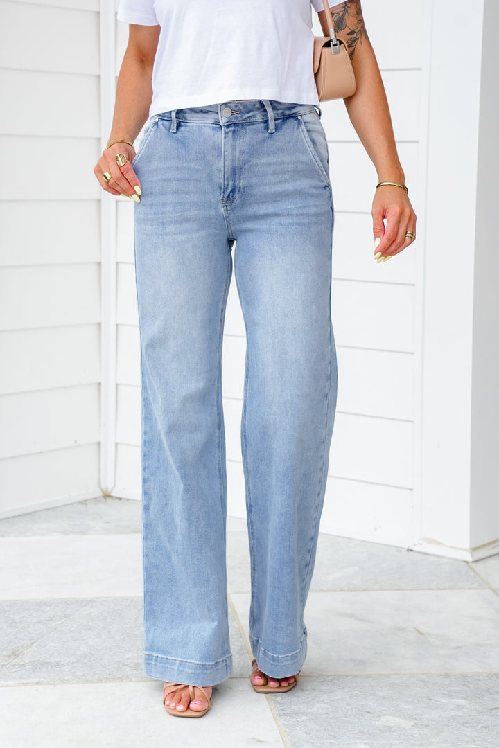 Risen High Rise Light Wash Wide Leg Jeans with Slanted Pockets