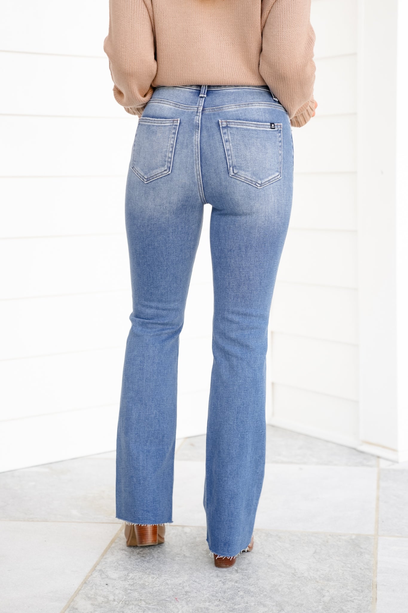 High Rise Medium Wash Flare Jeans with Raw Hem
