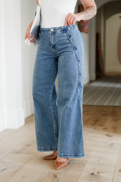 Risen High Rise Medium Wash Wide Leg Jeans with Scalloped Edge