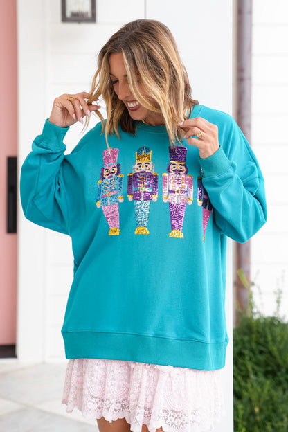 Long Sleeve Sweatshirt with Sequin Nutcrackers
