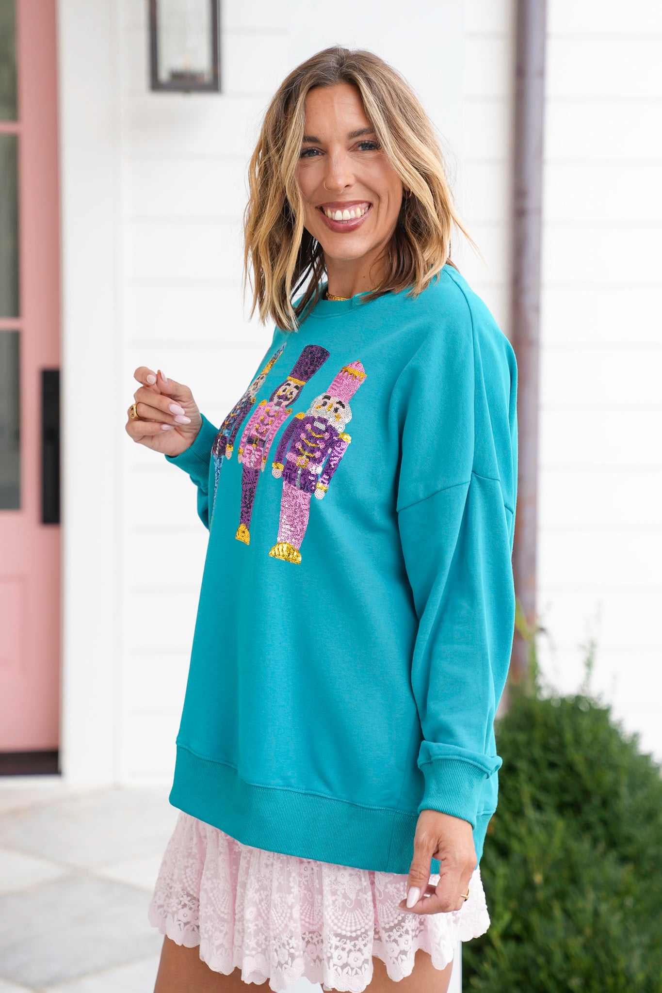 Long Sleeve Sweatshirt with Sequin Nutcrackers