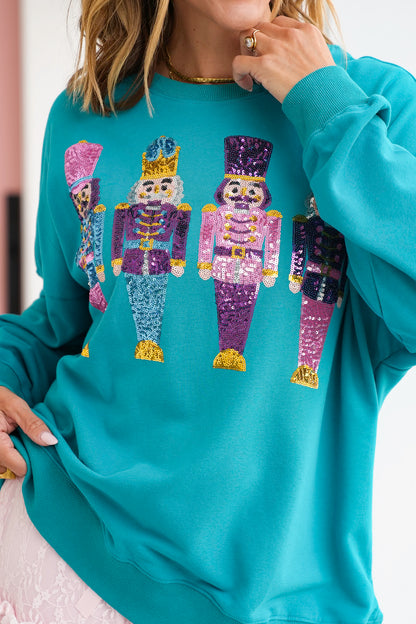 Long Sleeve Sweatshirt with Sequin Nutcrackers