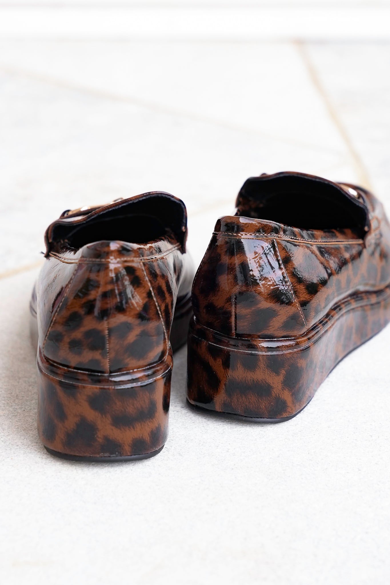 Glossy Chic Animal Print Patent Platform Loafer with Gold Accent