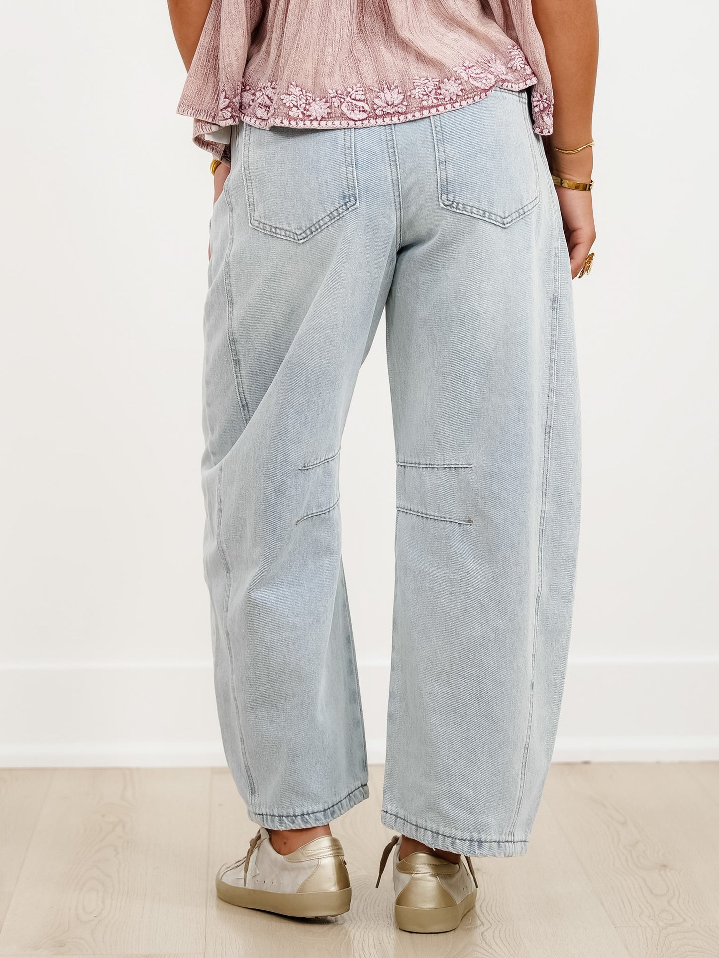 Distressed Light Wash Barrel Jeans with Eyelet Belt