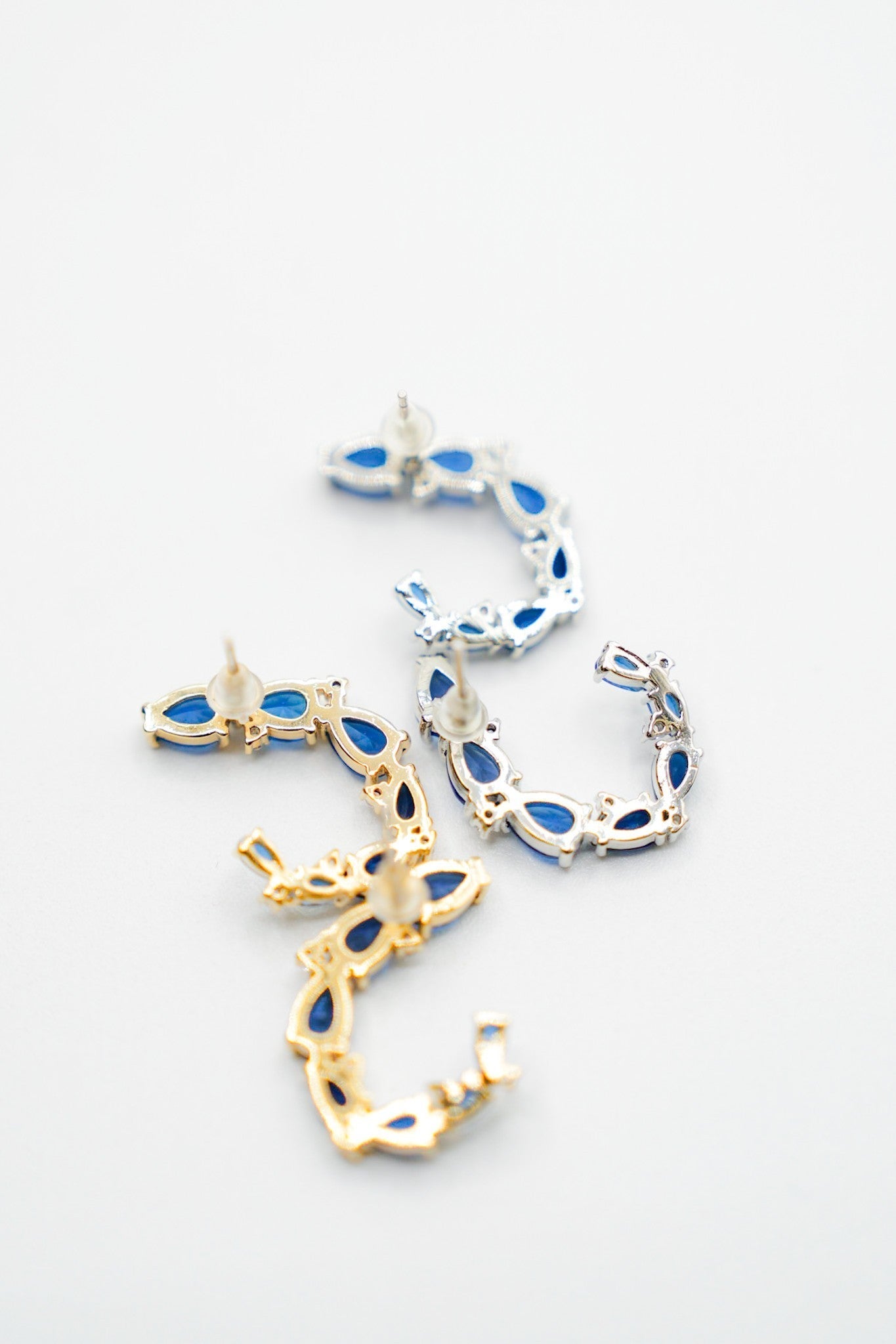 Love, Poppy Montana Blue Crystal Paved Curl Earring (Multiple Colors)